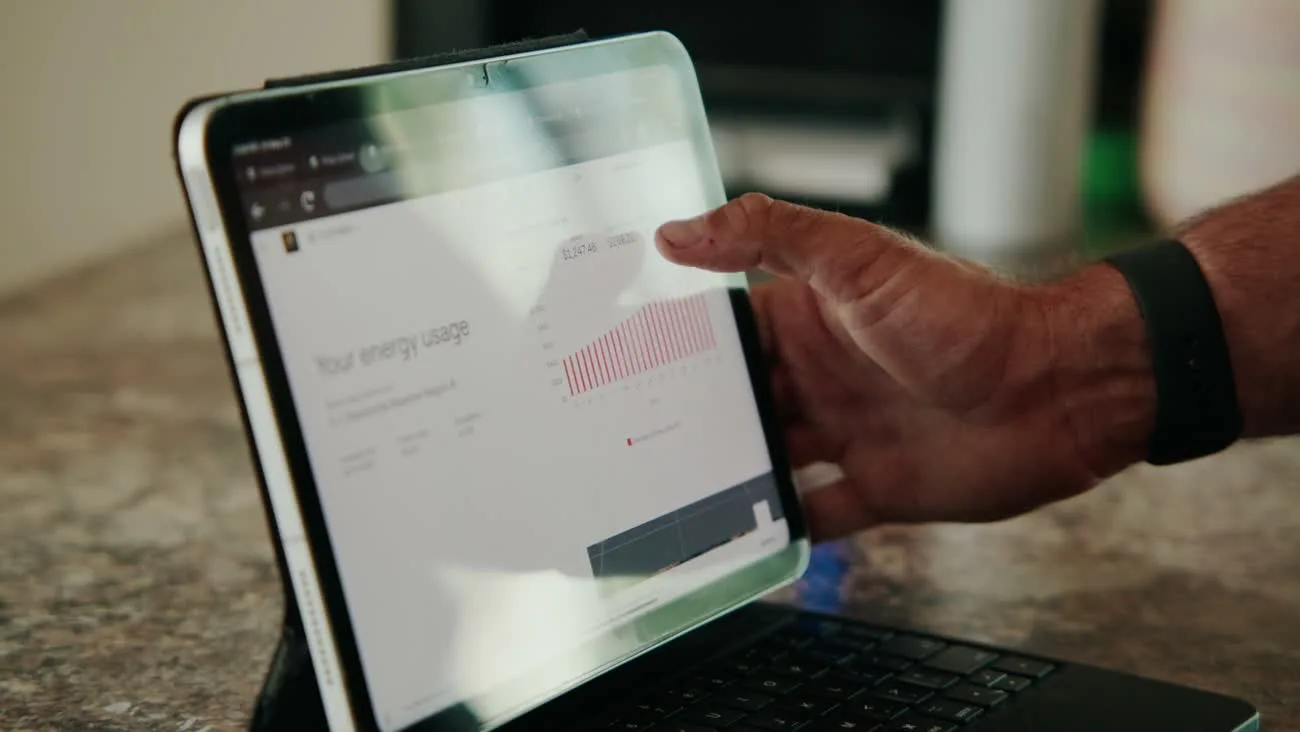 A homeowner checking solar production in the monitoring app