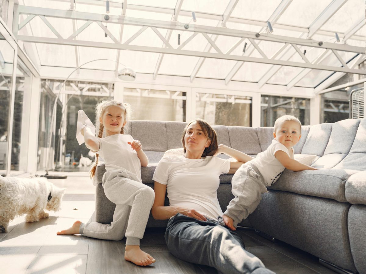 Homeowner with her children under her solar roof